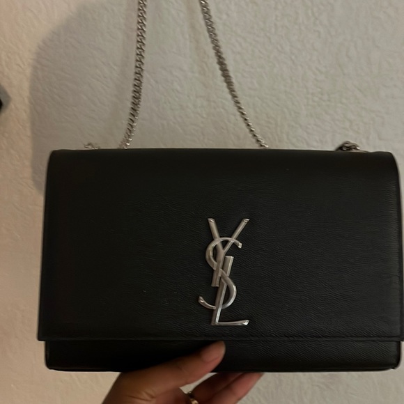 Yves Saint Laurent Handbags - Black small ysl purse gently used .